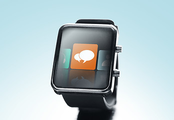 Image showing close up of black smart watch with messenger icon