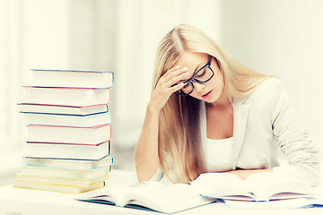 Image showing student with books and notes