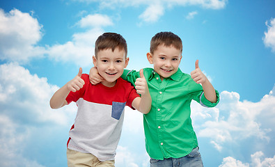 Image showing happy smiling little boys showing thumbs up