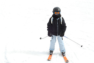 Image showing Girl skiing downhill