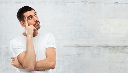 Image showing man thinking over gray background