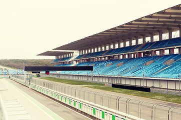 Image showing empty speedway and bleachers on stadium