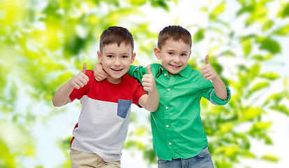 Image showing happy smiling little boys showing thumbs up