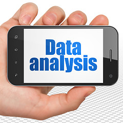 Image showing Data concept: Hand Holding Smartphone with Data Analysis on display