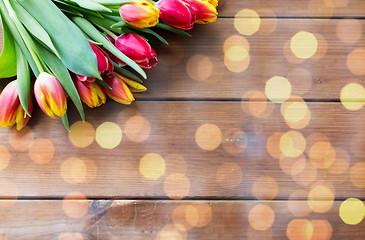 Image showing close up of tulip flowers on wooden table