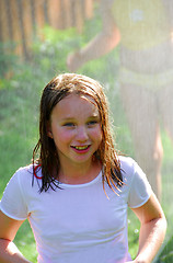 Image showing Girl and sprinkler