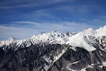 Image showing View on snowy mountains in sun day