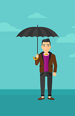 Image showing Businessman standing with umbrella.