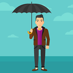 Image showing Businessman standing with umbrella.