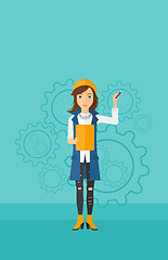 Image showing Woman standing on gears background.