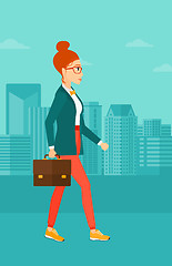 Image showing Business woman walking with briefcase. 