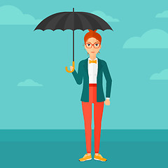 Image showing Business woman standing with umbrella.