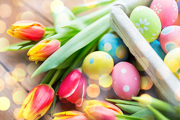 Image showing close up of colored easter eggs and flowers