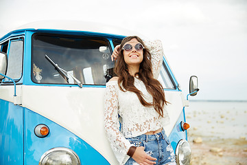 Image showing smiling young hippie woman in minivan car