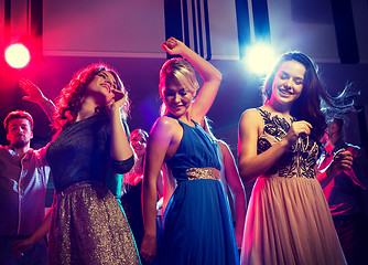 Image showing smiling friends dancing in club