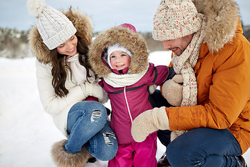 Image showing happy family with child in winter clothes outdoors