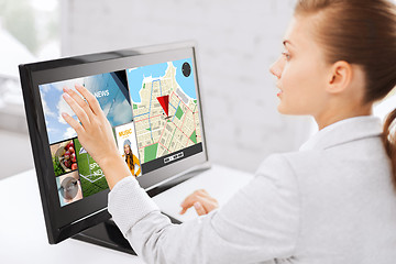 Image showing businesswoman with computer touchscreen in office