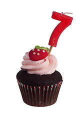 Image showing Mini cupcake with birthday candle for seven year old