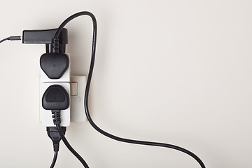 Image showing Overloaded ac power wall socket