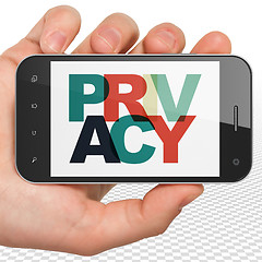 Image showing Security concept: Hand Holding Smartphone with Privacy on  display