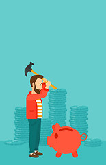 Image showing Man breaking piggy bank.