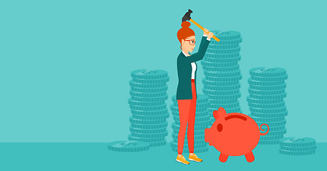 Image showing Woman breaking piggy bank.