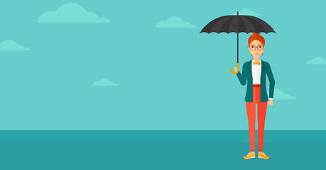 Image showing Business woman standing with umbrella.