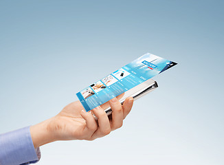 Image showing close up of hand with smartphone and news web page