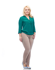 Image showing smiling young woman in shirt and trousers