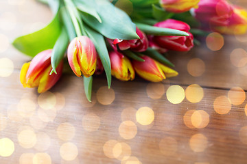 Image showing close up of tulip flowers on wooden table