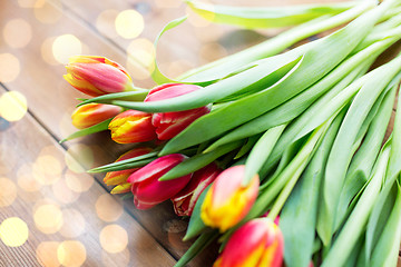 Image showing close up of tulip flowers on wooden table