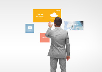 Image showing businessman with virtual projection of media icons