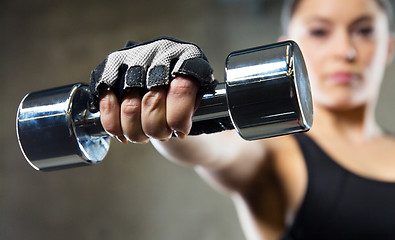 Image showing close up of sporty woman with steel dumbbell