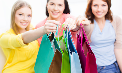 Image showing close up of happy teenage girls with shopping bags