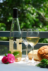 Image showing White wine with glasses outside