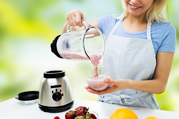 Image showing close up of woman with blender and shake at home
