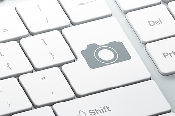 Image showing Vacation concept: Photo Camera on computer keyboard background
