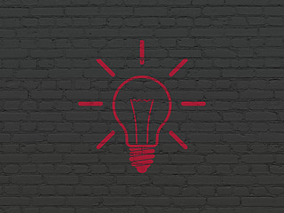 Image showing Finance concept: Light Bulb on wall background