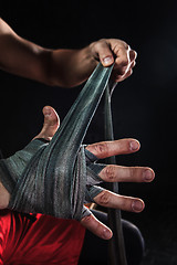 Image showing Close-up hands of muscular man with bandage