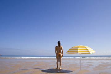 Image showing Woman standing at the beach