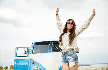 Image showing smiling young hippie woman in minivan car