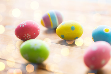 Image showing close up of colored easter eggs on wooden surface