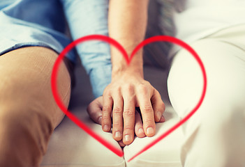 Image showing close up of happy male gay couple holding hands