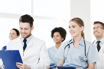 Image showing group of happy doctors on seminar at hospital