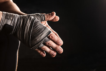 Image showing Close-up hand of muscular man with bandage