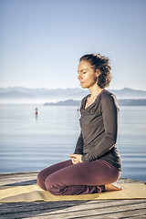 Image showing yoga woman sitting lake