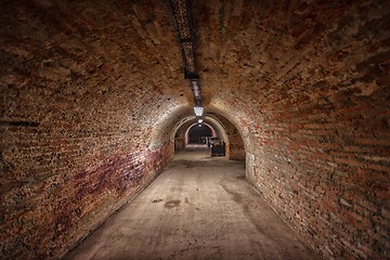 Image showing Long underground brick tunnel angle shot