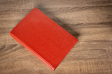 Image showing Red book on the table