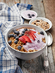 Image showing bowl of muesli with yogurt and berries