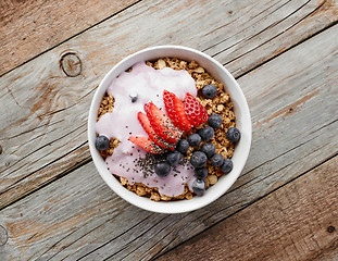 Image showing bowl of muesli with yogurt and berries